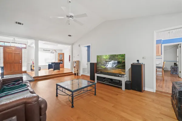 a view of a dining room with furniture window and wooden floor