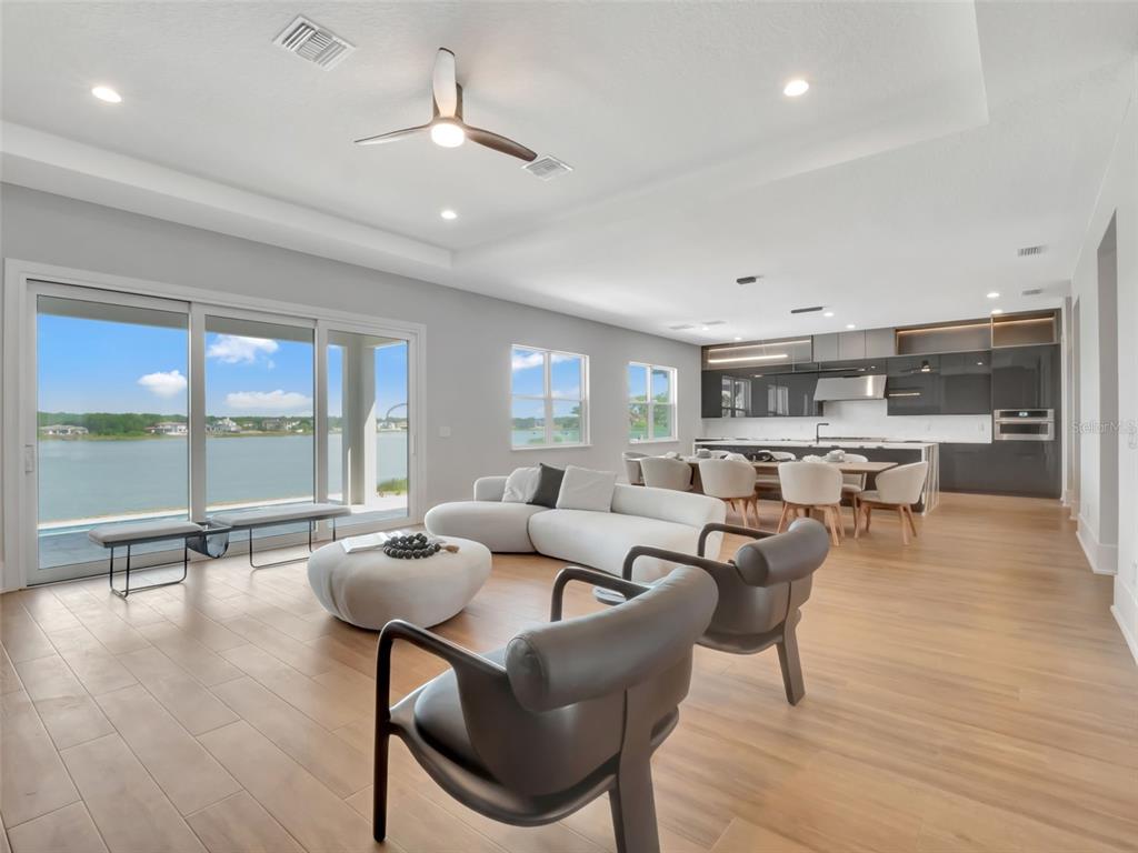 16808 Bolsena Drive Montverde, FL 34756 - Photo 17 of 68 a living room with furniture and a large window