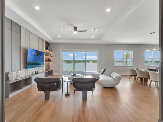 a dining room with furniture and wooden floor