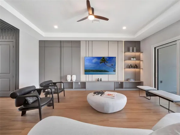 a dining room with furniture and wooden floor