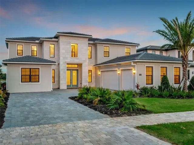 a front view of a house with a yard table and chairs