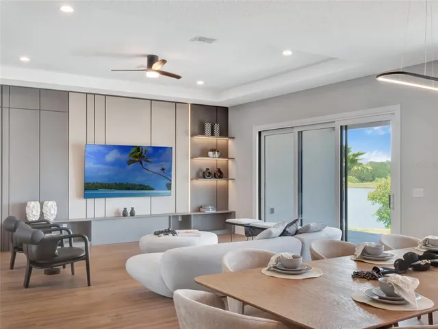 a large kitchen with lots of counter top space a sink appliances and cabinets