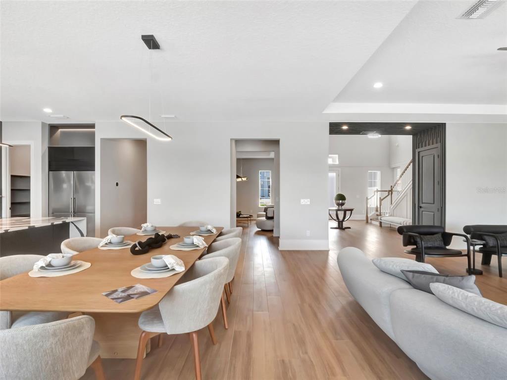 16808 Bolsena Drive Montverde, FL 34756 - Photo 25 of 68 a dining room with furniture and wooden floor