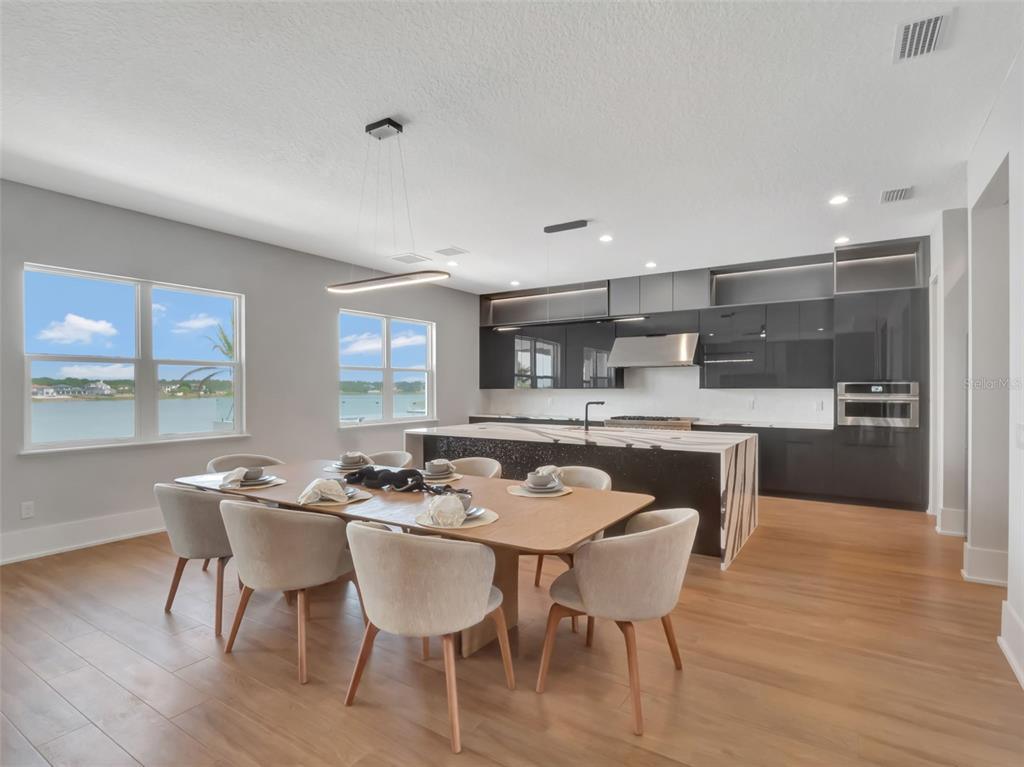 16808 Bolsena Drive Montverde, FL 34756 - Photo 28 of 68 a dining room with furniture and wooden floor