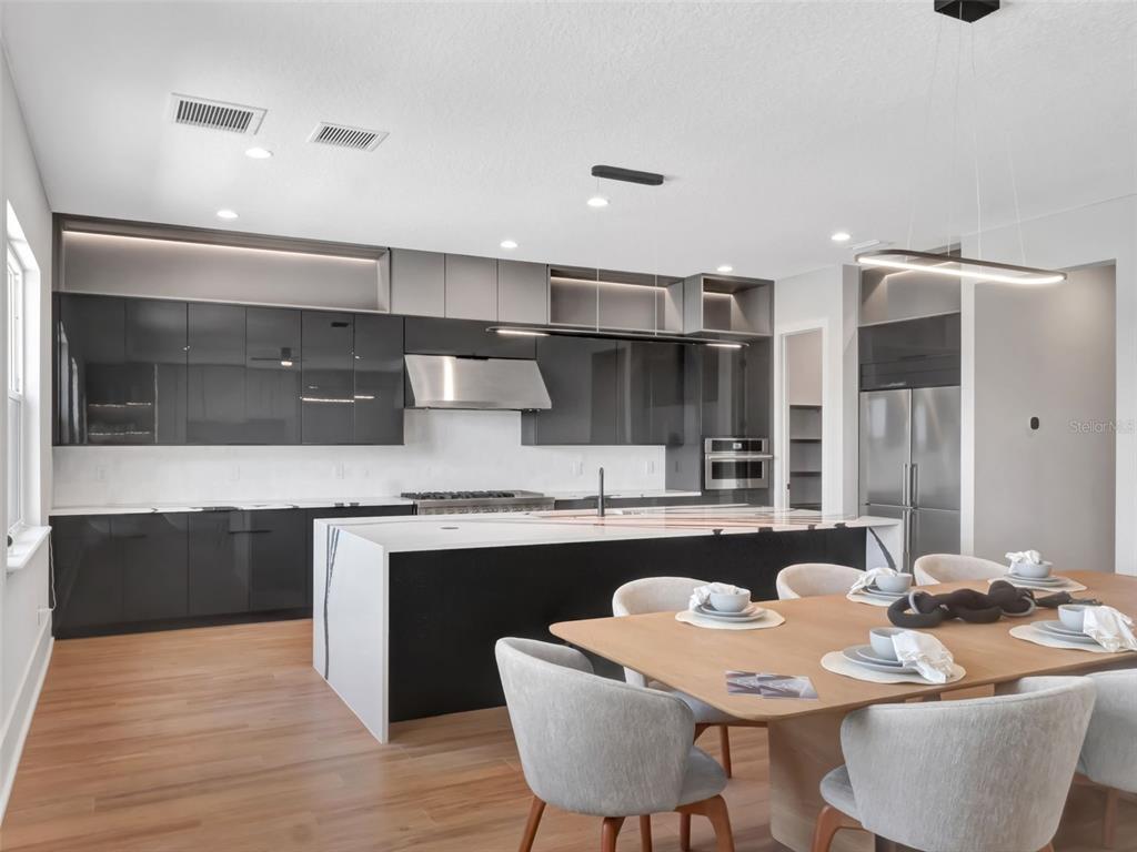 16808 Bolsena Drive Montverde, FL 34756 - Photo 29 of 68 a kitchen with granite countertop a sink and cabinets