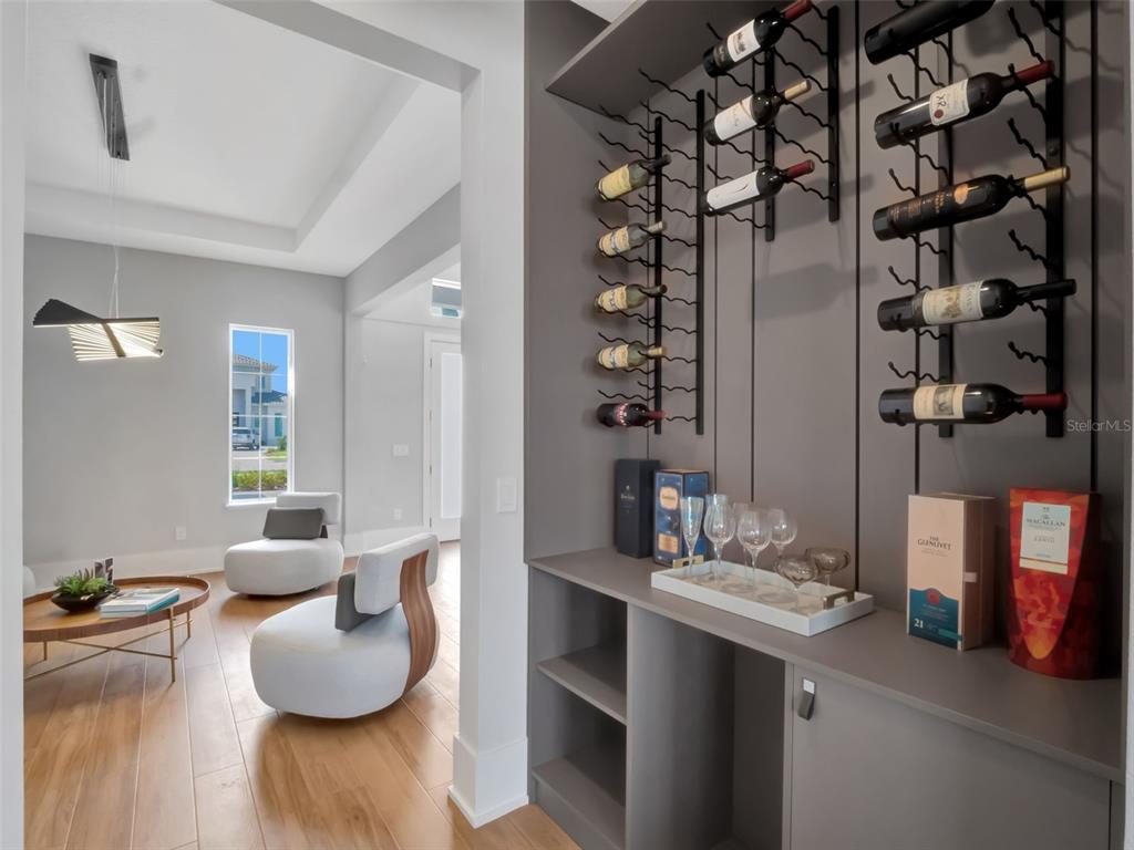 16808 Bolsena Drive Montverde, FL 34756 - Photo 35 of 68 a bathroom with a granite countertop sink and a mirror