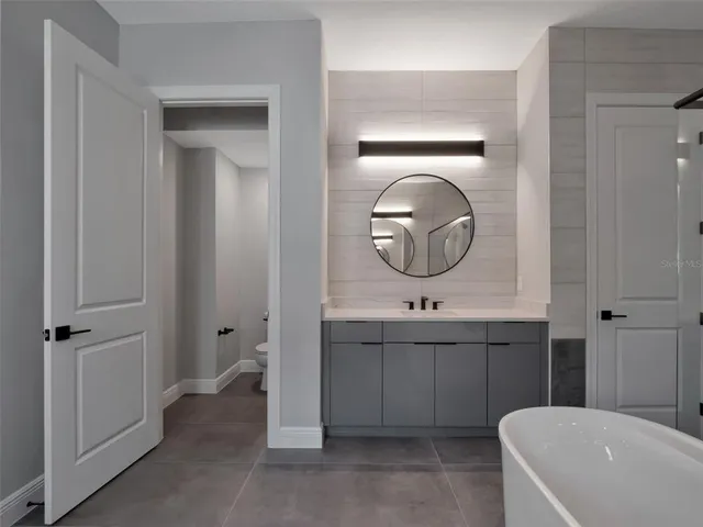 a bedroom with a bed and a closet