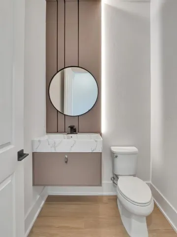 an aerial view of residential houses with outdoor space and swimming pool