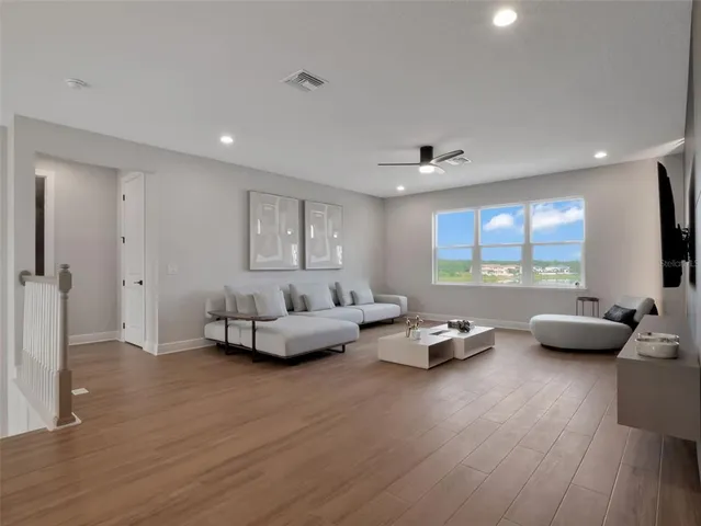 an aerial view of a swimming pool with a yard and mountain view