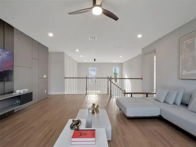 a view of a swimming pool of a house with a yard and lake view