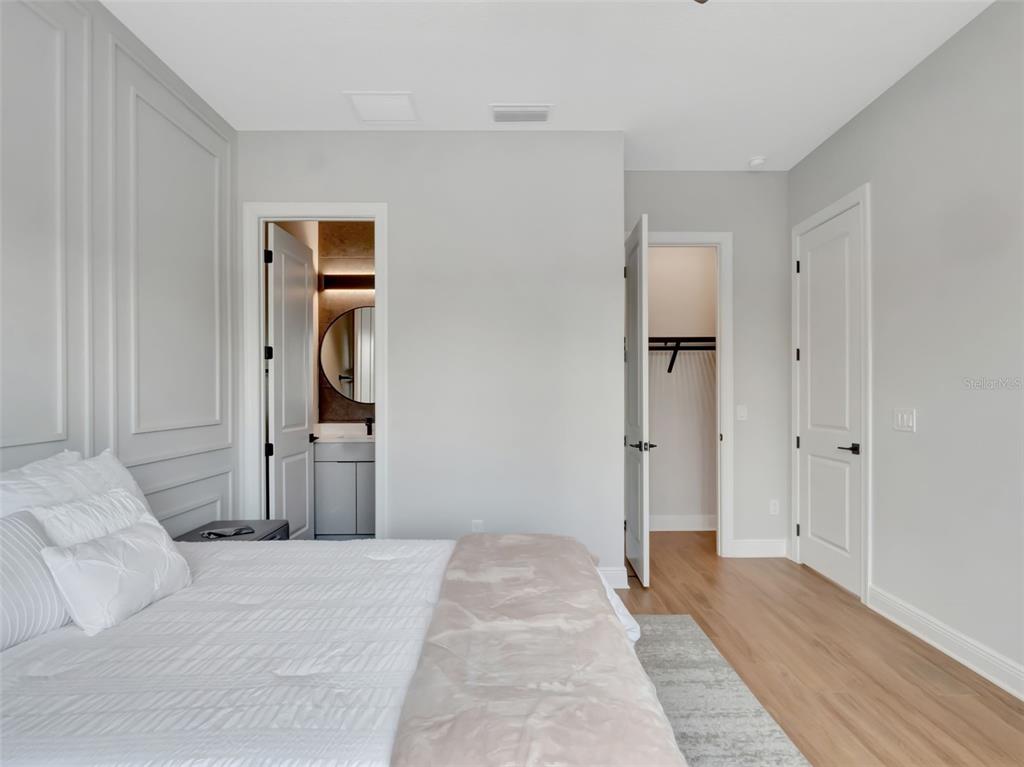 16808 Bolsena Drive Montverde, FL 34756 - Photo 52 of 68 a bedroom with a bed and a closet