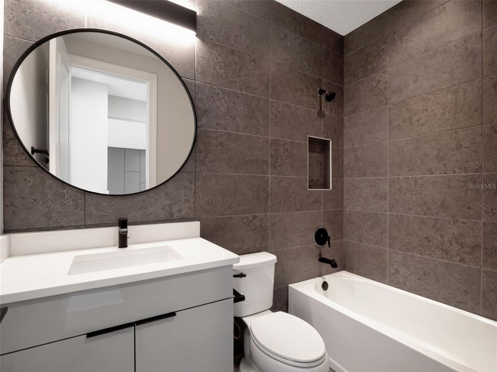 16808 Bolsena Drive Montverde, FL 34756 - Photo 53 of 68 a bathroom with a sink toilet and shower