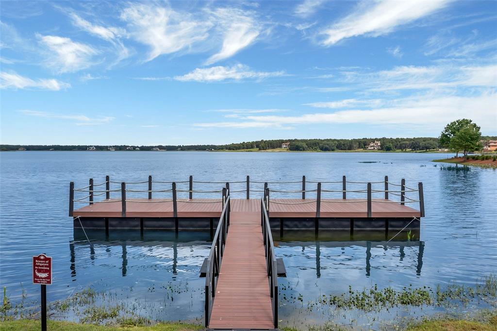 16808 Bolsena Drive Montverde, FL 34756 - Photo 64 of 68 a terrace with outdoor seating and city view