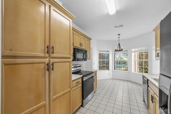 a kitchen with stainless steel appliances a refrigerator and a sink