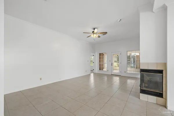 a view of an empty room with a fireplace