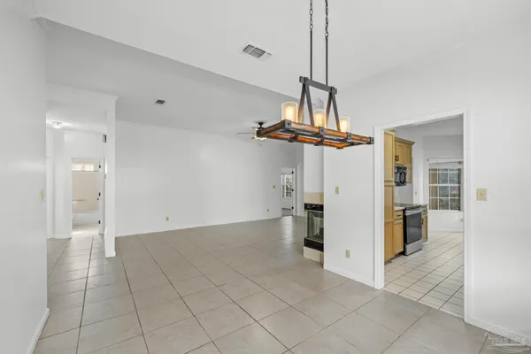 a view of a kitchen with a sink and a chandelier