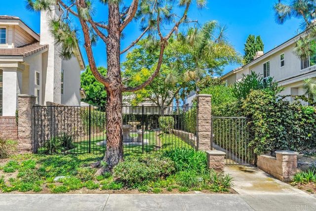 front view of a house with a garden