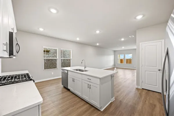 a kitchen with a stove and a sink