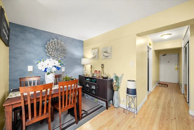 a bedroom with furniture and wooden floor