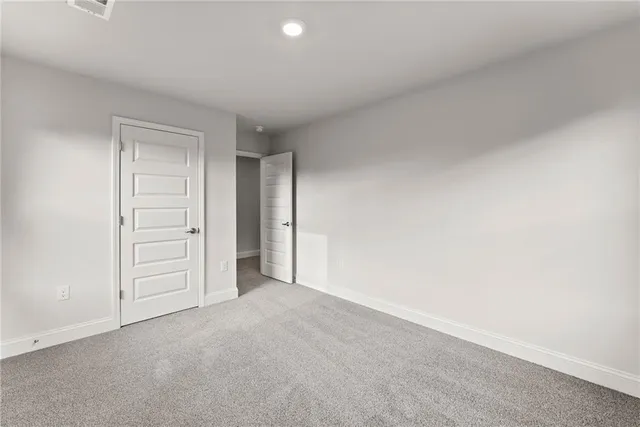 a view of an empty room and closet