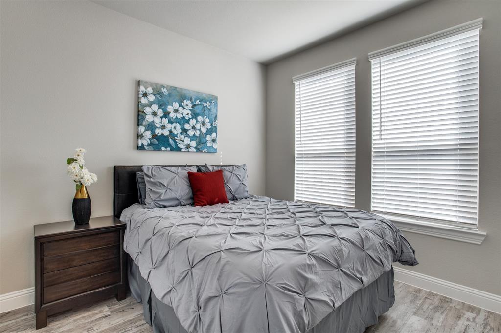 1718 Lisa Court Allen, TX 75002 - Photo 16 of 26 a bedroom with a bed and a window