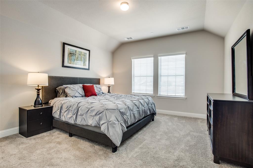 1718 Lisa Court Allen, TX 75002 - Photo 17 of 26 a spacious bedroom with a bed and a window