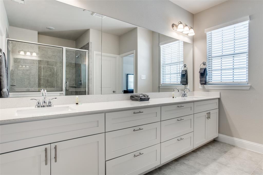 1718 Lisa Court Allen, TX 75002 - Photo 20 of 26 a bathroom with double sink and a mirror