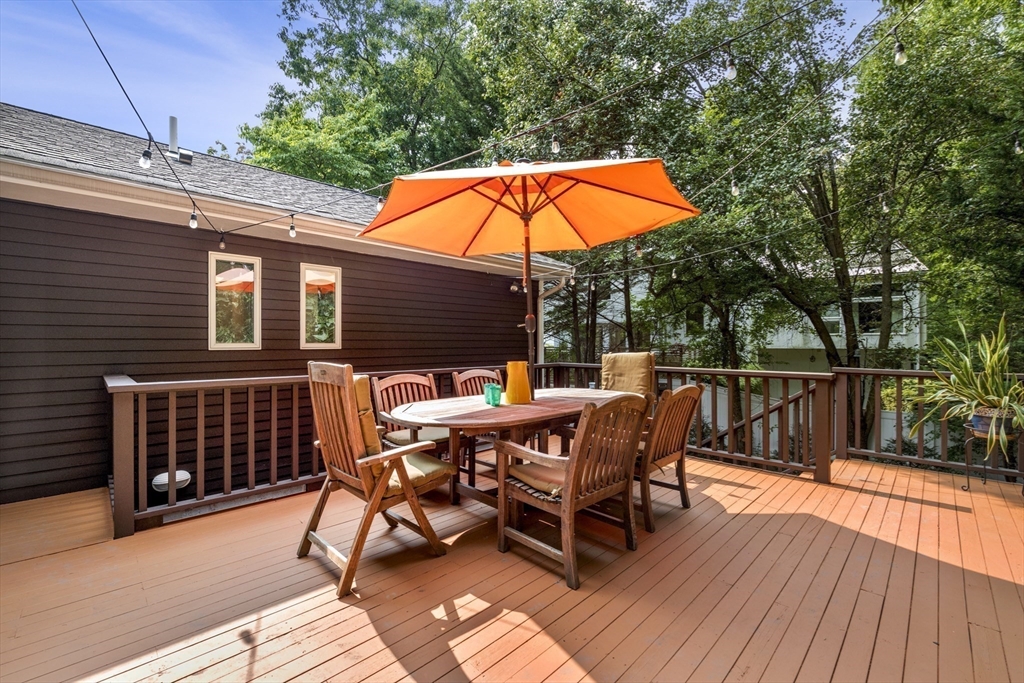 64 Botsford Road Newton, MA 02467 - Photo 5 of 6 a balcony with wooden floor and outdoor seating