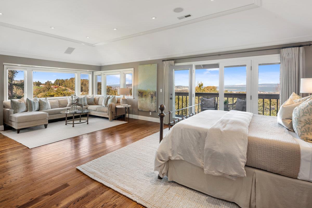 714 Jacaranda Circle Hillsborough, CA 94010 - Photo 17 of 57 a bedroom with a large bed and a large window