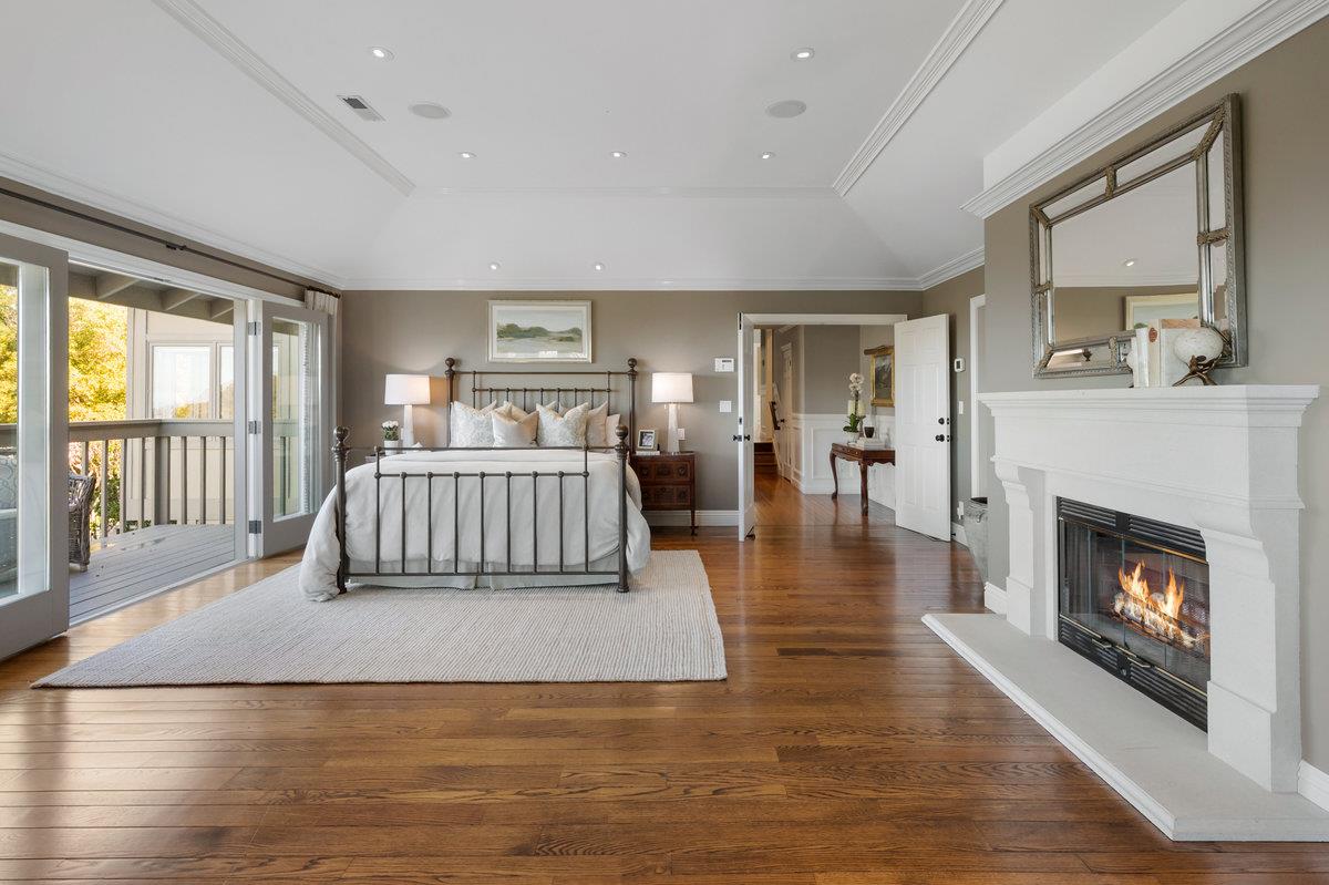 714 Jacaranda Circle Hillsborough, CA 94010 - Photo 18 of 57 a living room with a couch windows and a fireplace