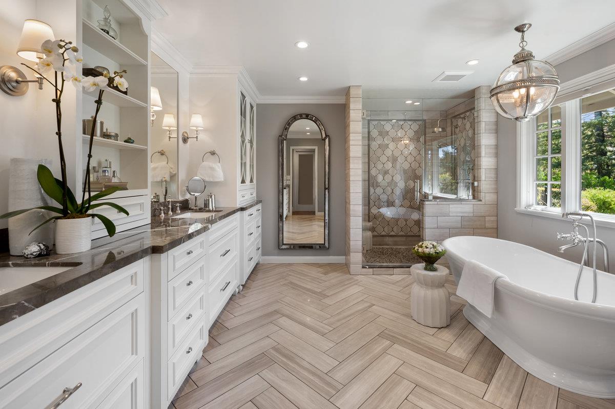 714 Jacaranda Circle Hillsborough, CA 94010 - Photo 20 of 57 a spacious bathroom with a double vanity sink a large mirror and a bathtub
