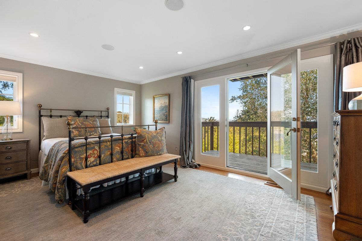 714 Jacaranda Circle Hillsborough, CA 94010 - Photo 24 of 57 a bed sitting in a spacious bedroom next to a window