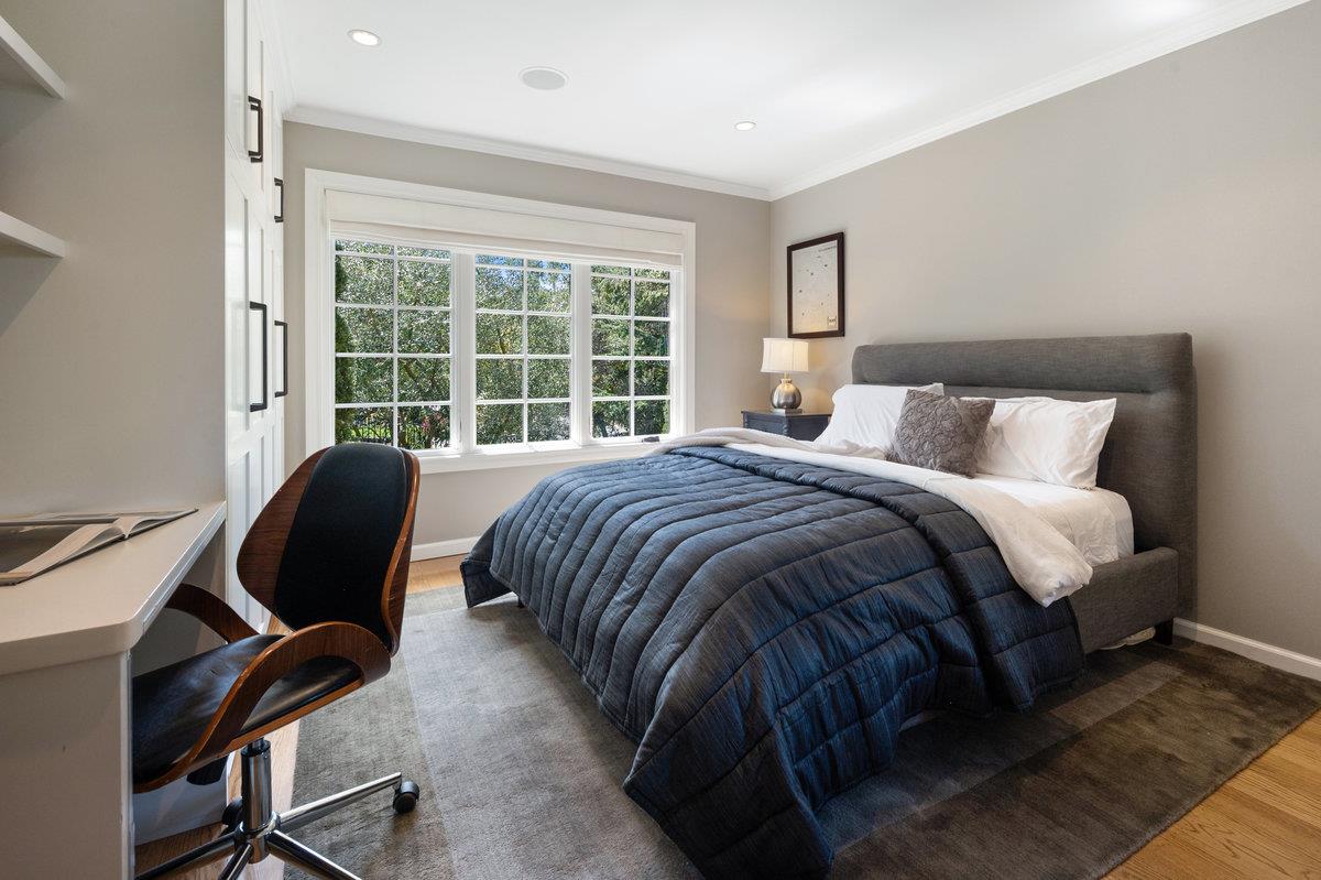 714 Jacaranda Circle Hillsborough, CA 94010 - Photo 27 of 57 a bedroom with a bed two lamps and a large window