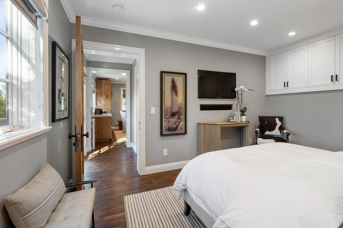 714 Jacaranda Circle Hillsborough, CA 94010 - Photo 37 of 57 a bedroom with a bed and a flat screen tv