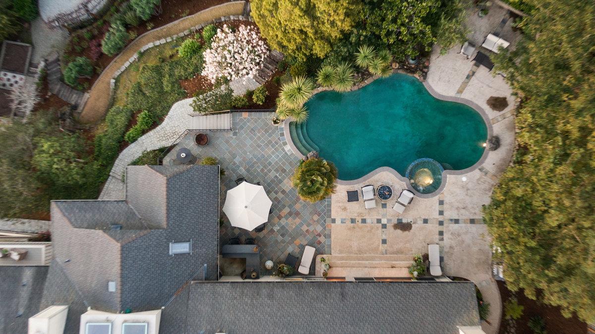 714 Jacaranda Circle Hillsborough, CA 94010 - Photo 55 of 57 an aerial view of a house with a yard and large trees