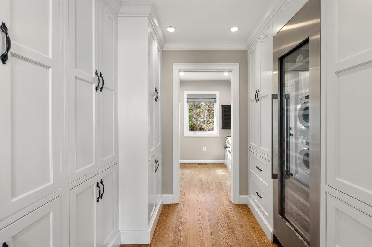 714 Jacaranda Circle Hillsborough, CA 94010 - Photo 6 of 57 a view of a hallway with wooden floor and a bathroom