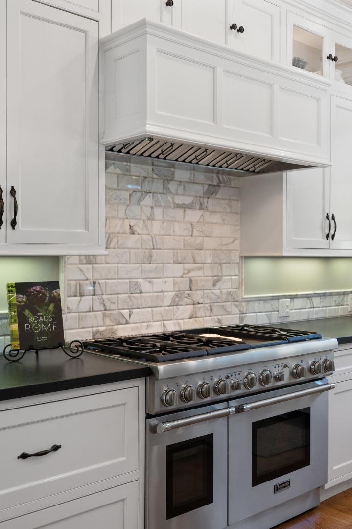 714 Jacaranda Circle Hillsborough, CA 94010 - Photo 8 of 57 a stove top oven sitting inside of a kitchen