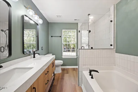 a bathroom with a bathtub and a shower
