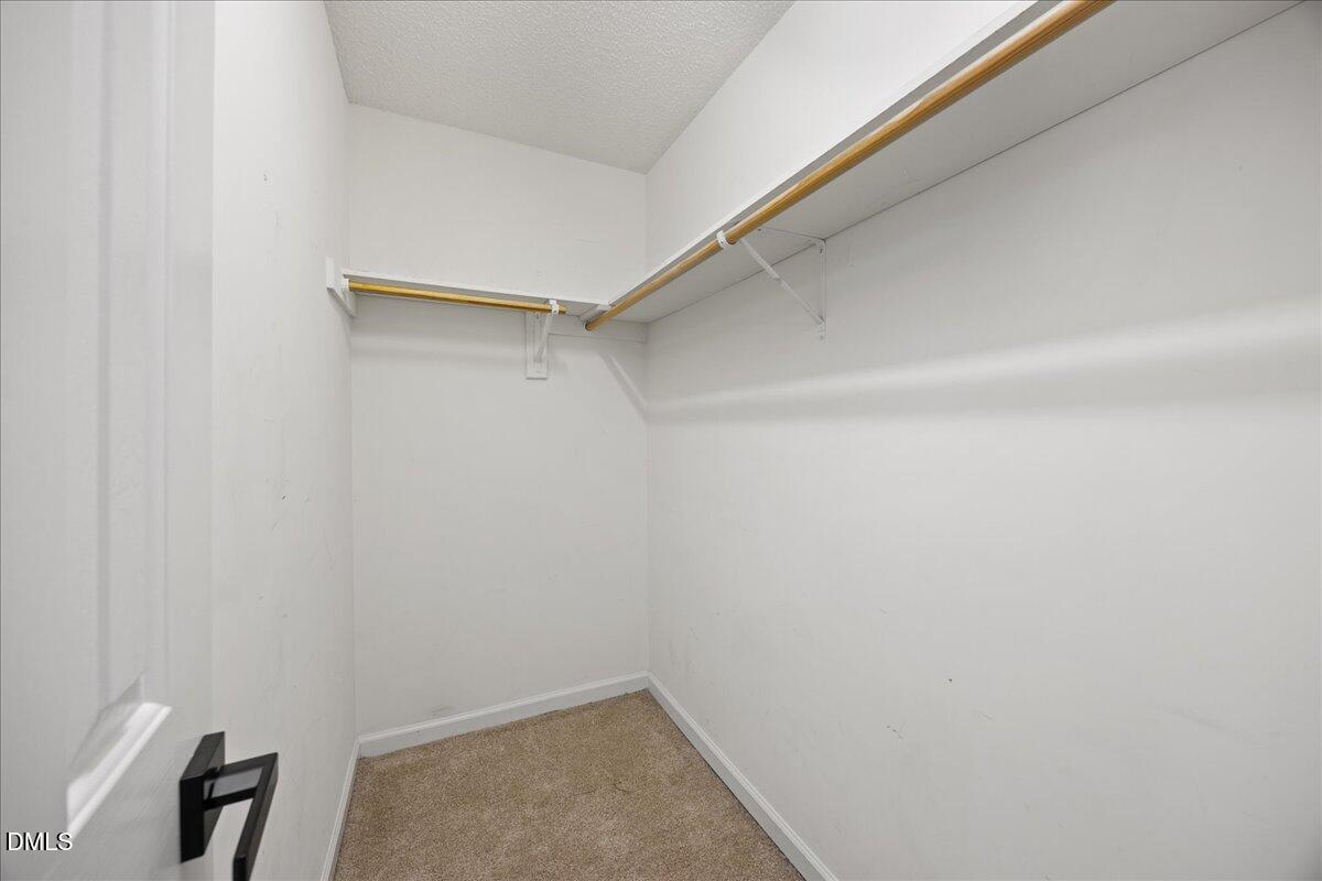 4329 Pine Springs Court Raleigh, NC 27613 - Photo 28 of 35 a view of a room with shelf