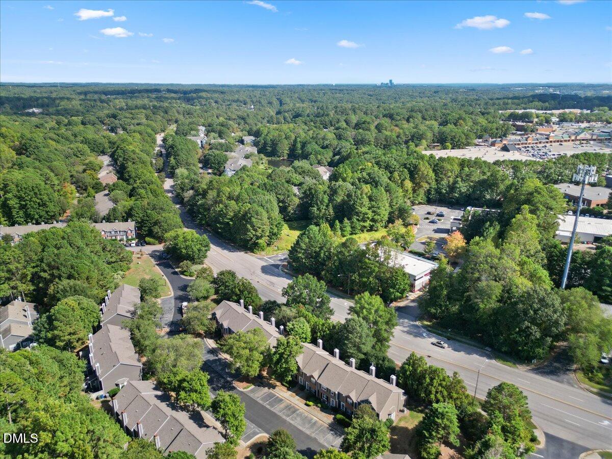 4329 Pine Springs Court Raleigh, NC 27613 - Photo 31 of 35 an aerial view of a houses with a yard and lake view