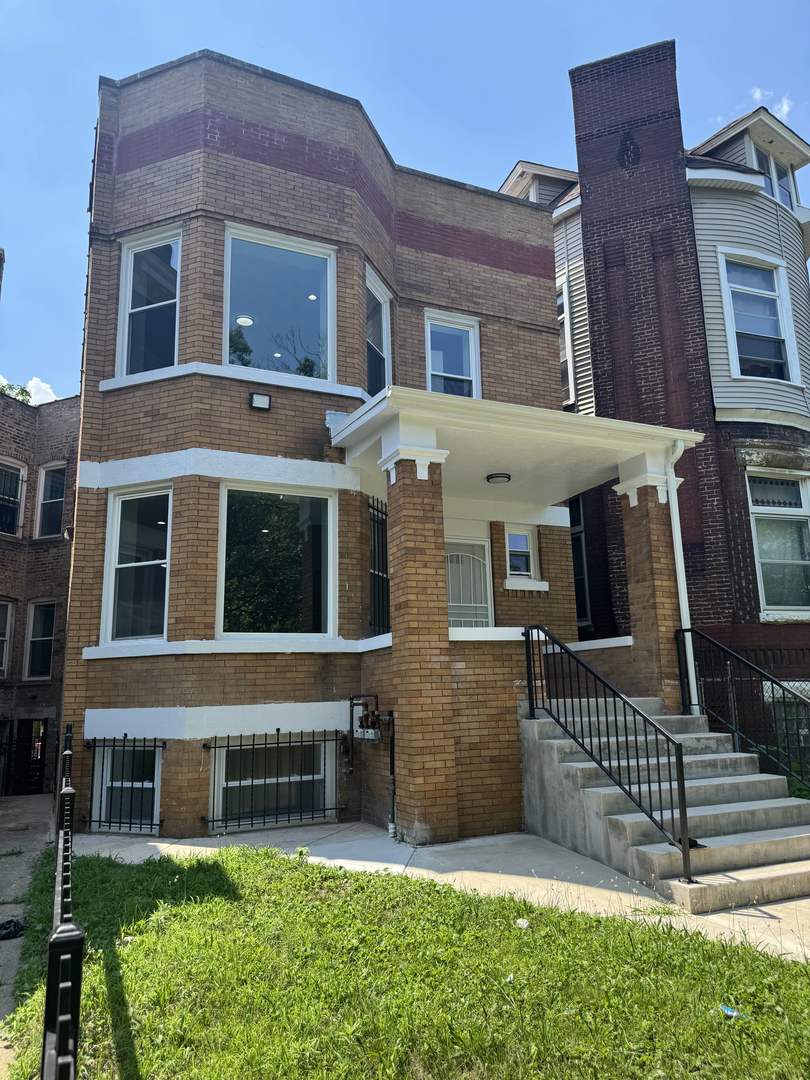7204 South Union Avenue Chicago, IL 60621 - Photo 2 of 12 a front view of a house with a yard
