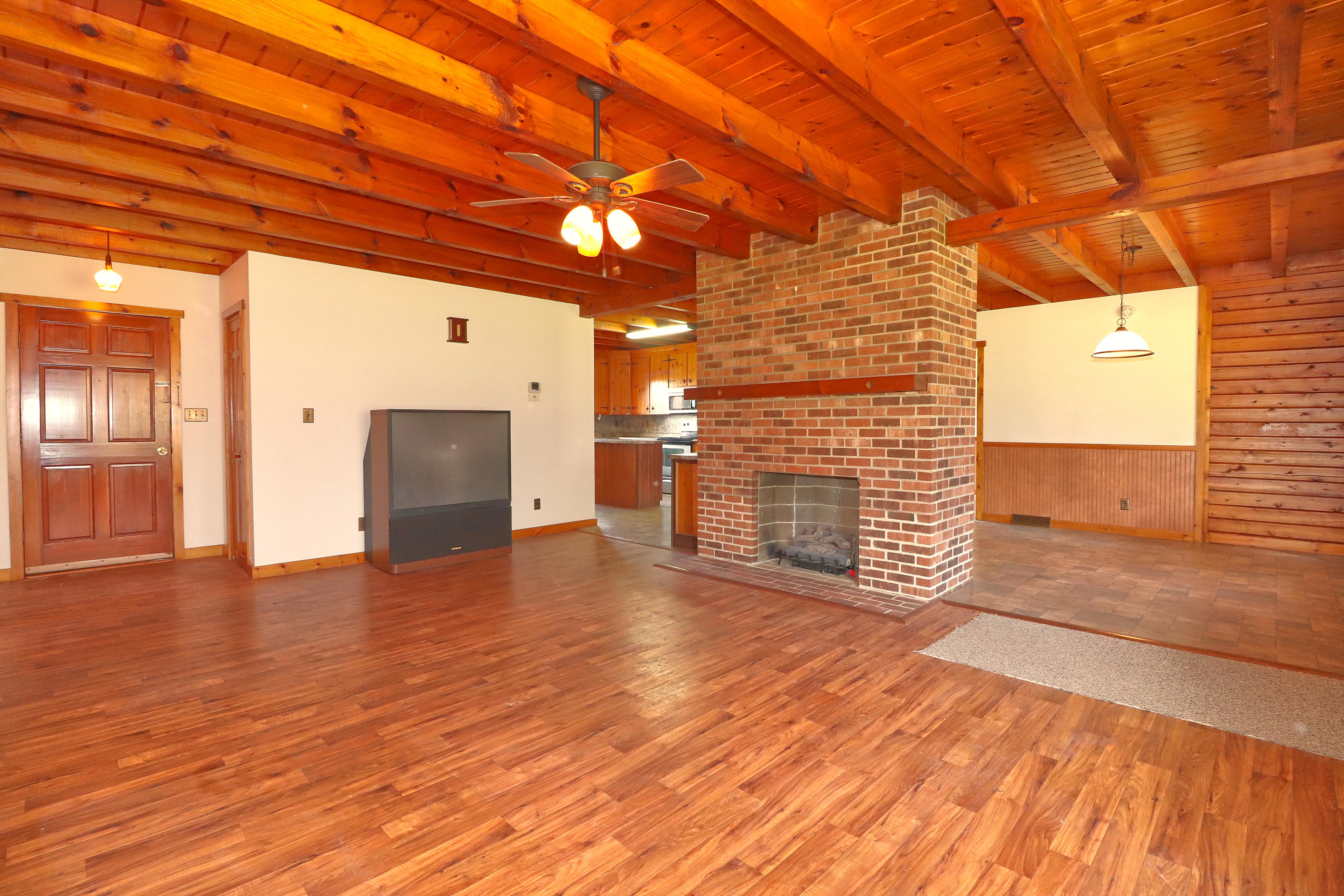 485 Haw Patch Road Ferrum, VA 24088 - Photo 8 of 23 a view of empty room with wooden floor and fireplace