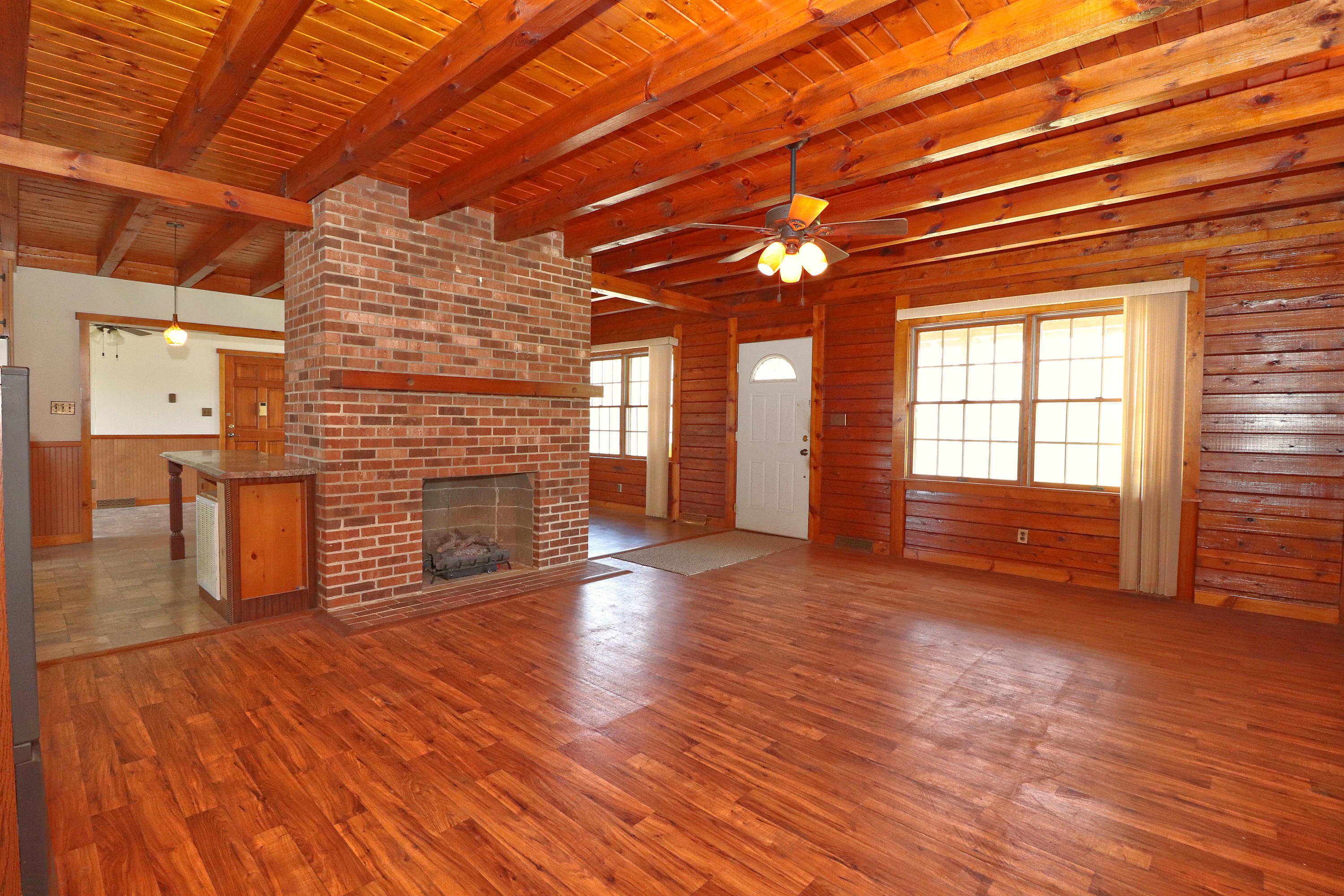 485 Haw Patch Road Ferrum, VA 24088 - Photo 9 of 23 a view of empty room with wooden floor and fireplace
