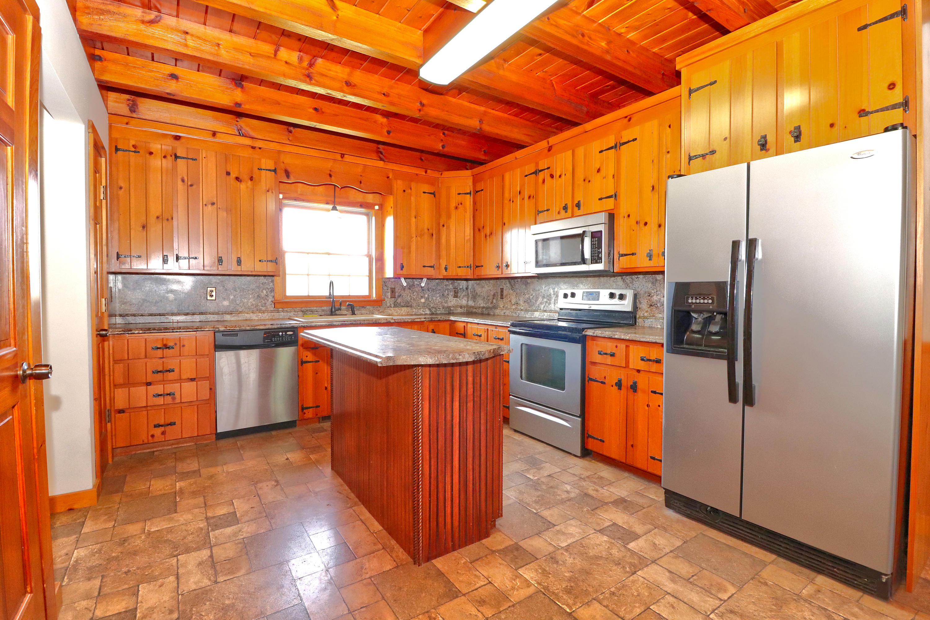 485 Haw Patch Road Ferrum, VA 24088 - Photo 10 of 23 a kitchen with stainless steel appliances granite countertop a stove a refrigerator and a sink