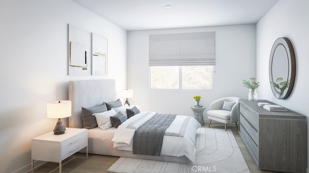 4102 East Elma Privado, Unit 101 Ontario, CA 91764 - Photo 3 of 5 a bedroom with furniture and a window