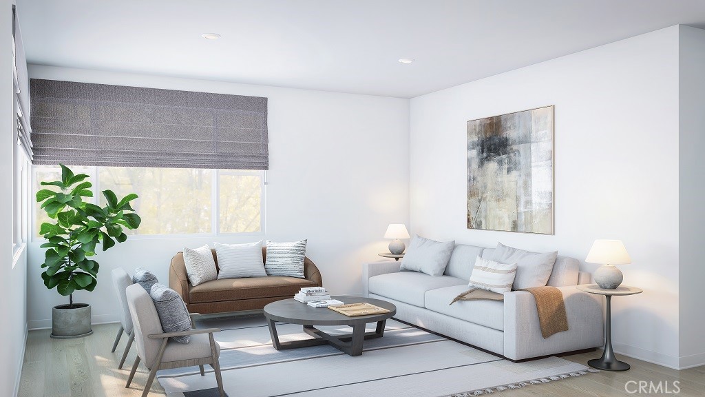 4102 East Elma Privado, Unit 101 Ontario, CA 91764 - Photo 5 of 5 a living room with furniture and a potted plant