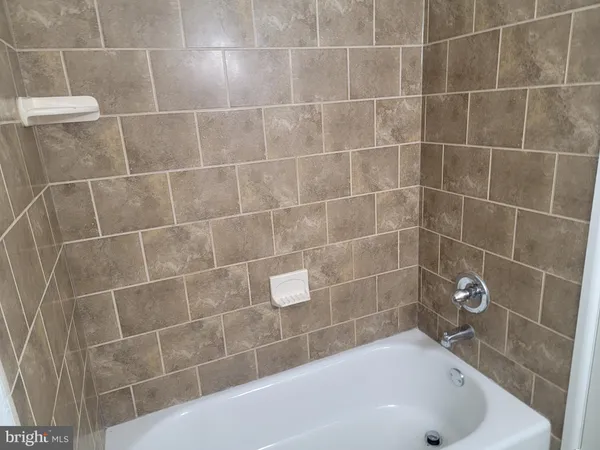 a bathroom with a sink toilet and mirror