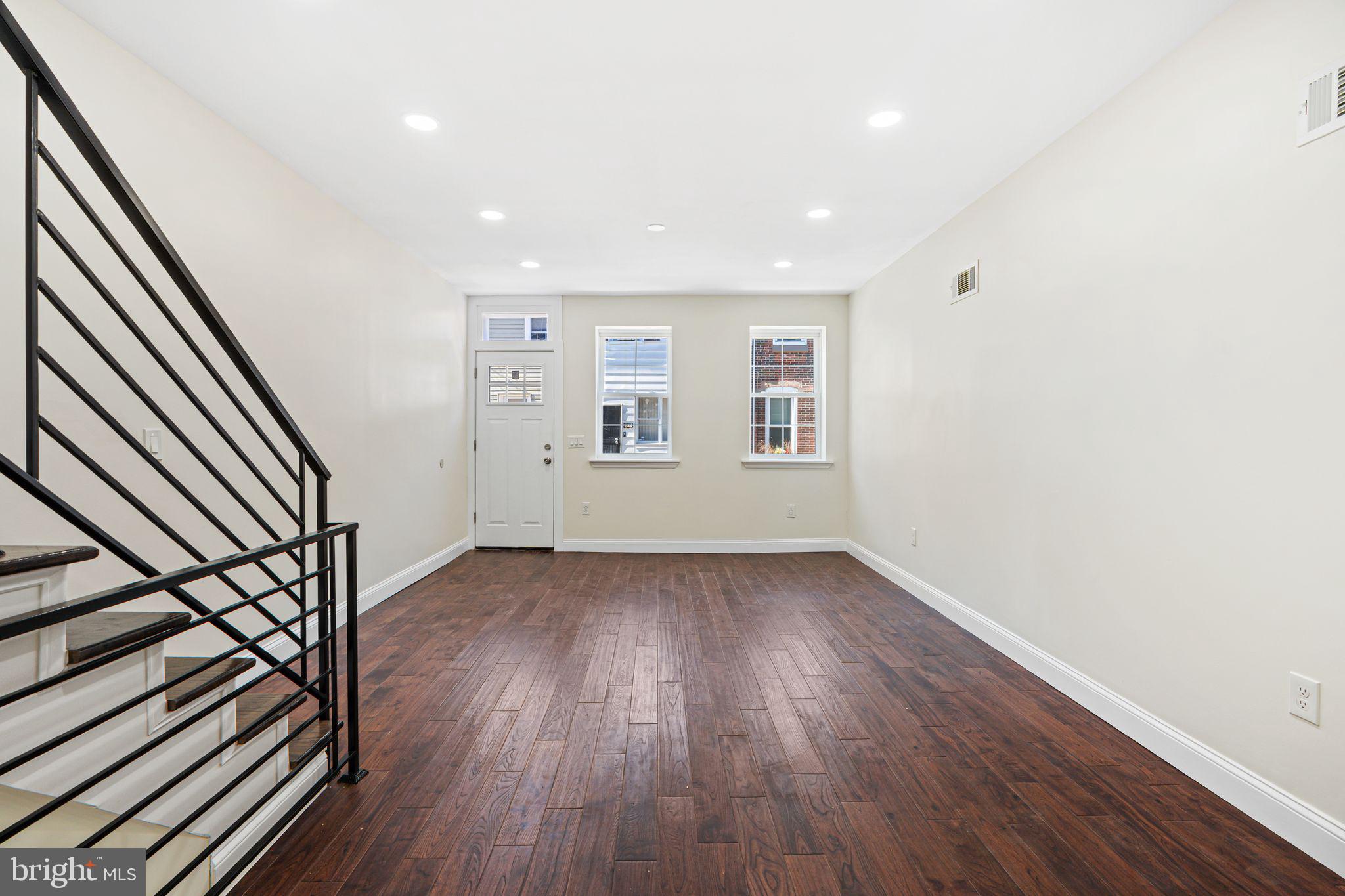 1535 South Mole Street Philadelphia, PA 19146 - Photo 13 of 28 wooden floor in an empty room with a window