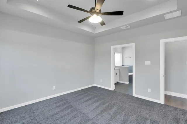 a bathroom with a tub a sink and a mirror