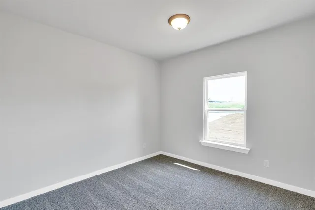 a bathroom with a toilet a sink a tub and mirror